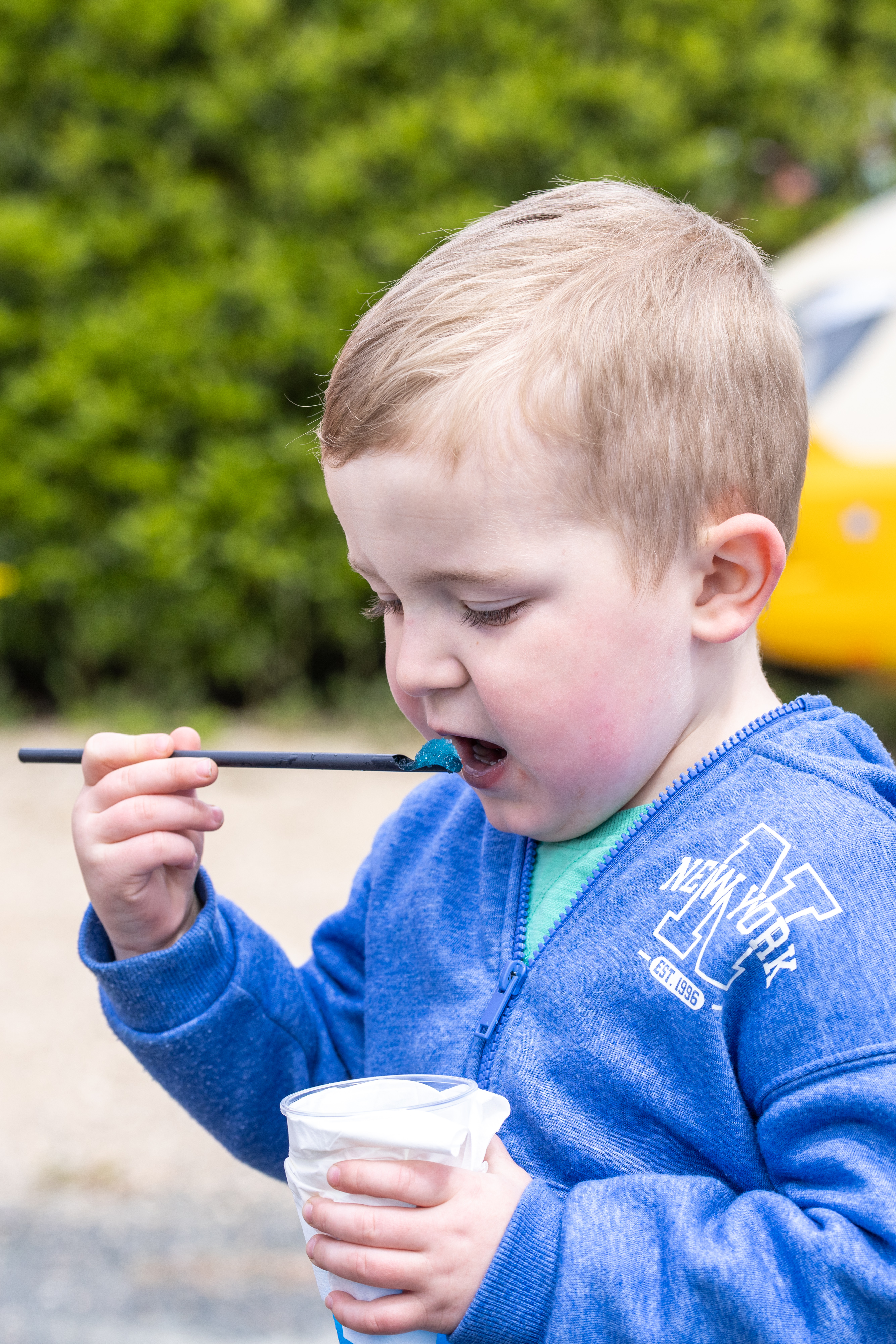 Child eating slushie.